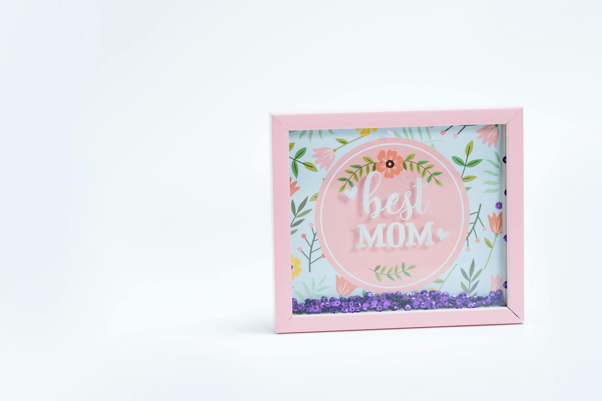 Charming pink floral frame with 'Best Mom' text, perfect for Mother's Day gift.